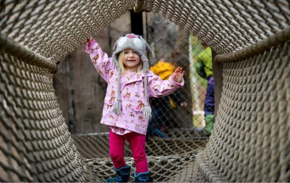 little girl playing in the nets