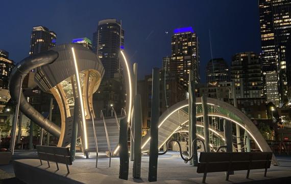 the Pier 58 Playground in Seattle lit at night