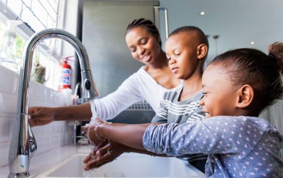 Family washing their hands together