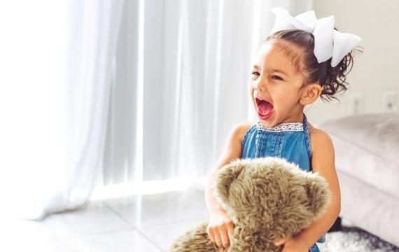 screaming little girl toddler playing at home