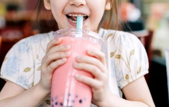 little girl drinking boba bubble tea