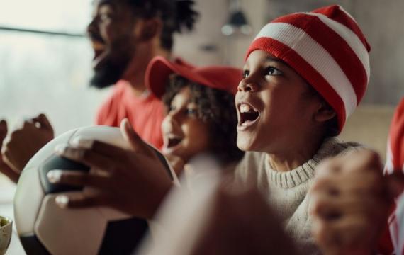 family watching soccer game