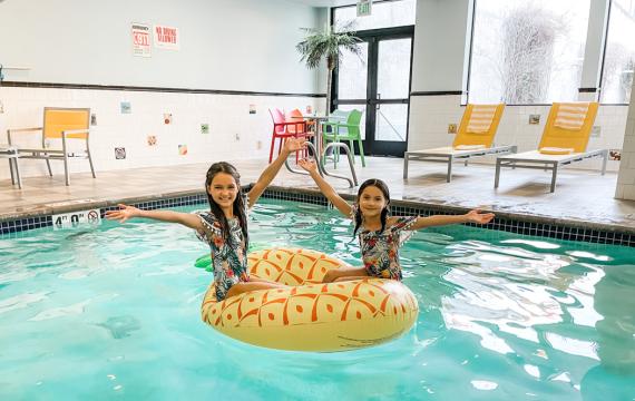two happy girls at a pool at Maxwell Hotel