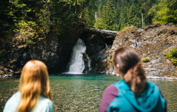 kids watching a waterfall near Seattle on a family-friendly hike