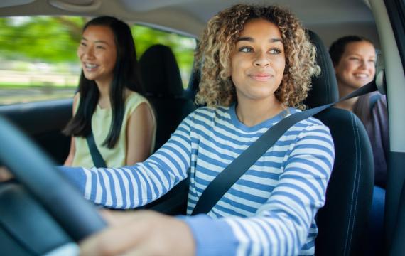 teen girls driving in a car