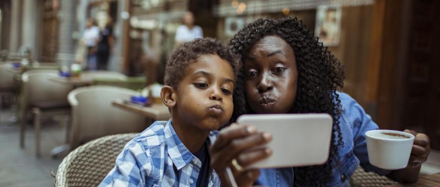 Mom-and-son-at-cafe-taking-selfie-parent-kid-date-night-ideas