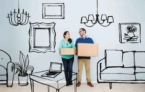 Couple with cardboard boxes in an illustrated house