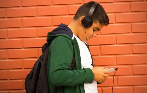 Teenage boy listening to headphones
