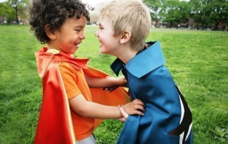 Two little boys in capes