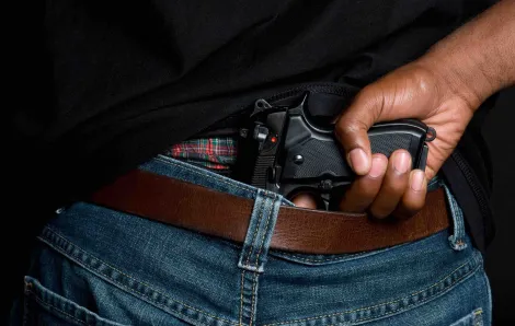 Gun hidden in waistband of jeans
