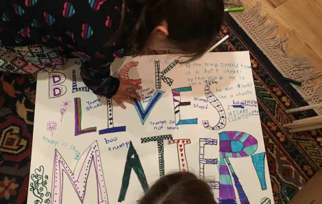 Natalie Singer-Velush's daughters creating a Black Lives Matter poster