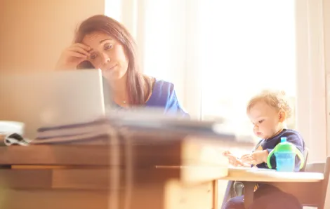 Young mother with computer and child