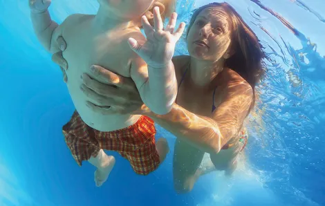 Baby swimming under water 