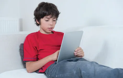 Tween boy using a tablet