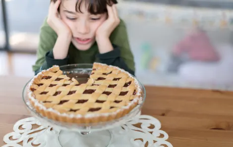 Kid looking at pie