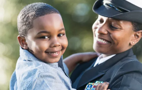Kid with mom in Navy uniforn