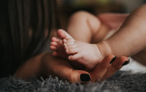 mother baby feet