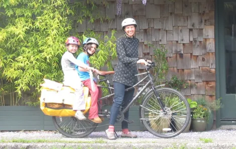 Mom toting kids on bike