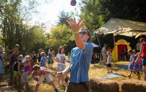 a kid at an outdoor music festival in seattle dances
