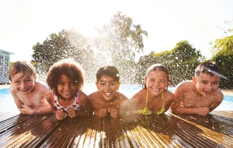 end of summer fun with laughing kids in pool
