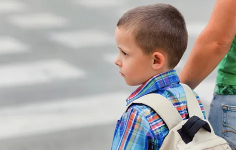 Young boy going to school