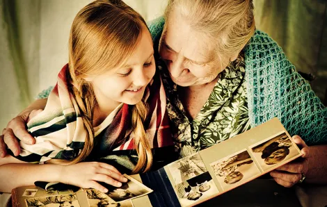 granddaughter and grandmother looking at photos