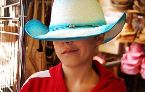 Boy wearing a cowboy hat