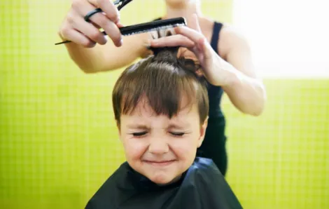 kid getting hair cut