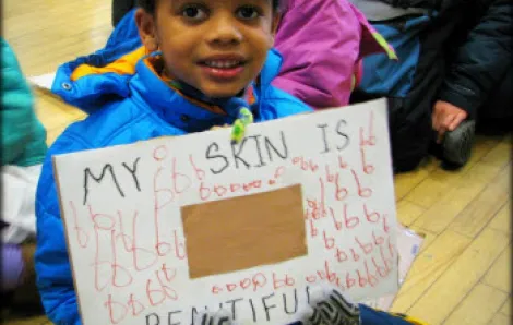 Cute child proudly shares his artwork