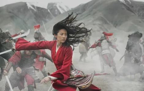 Battle scence showing Yifei Liu as Mulan in Disney's new live-action remake of the film