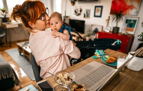 Parent-with-baby-on-laptop