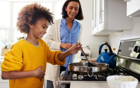 preteen-girl-cooking-with-mom