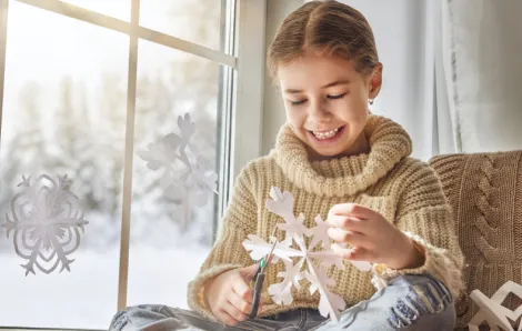 kid-making-paper-snowflake