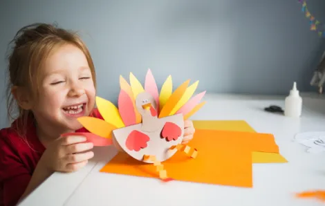 kid-making-paper-turkey