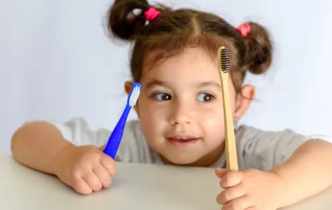 Kid-holding-Bamboo-Toothbrush