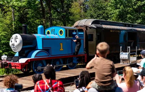 A life-size Thomas the Tank Engine pulls a train car at the Day Out With Thomas event near Seattle at the Northwest Railway Museum in Snoqualmie, Washington