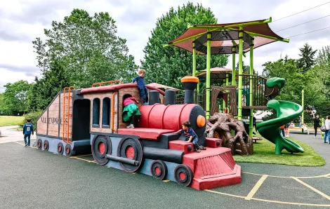 Playground train with children climbing on it at Mercerdale Park