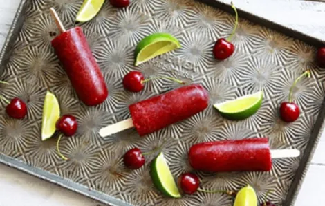cherry lime popsicles line a sheet, an easy summer dessert recipe
