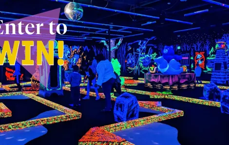 "Enter to Win" text over glow in the dark mini golf
