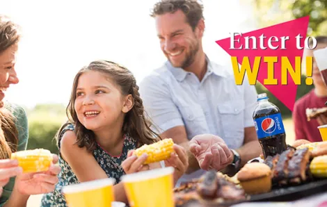 "Enter to Win!" text over a family enjoying barbecue 