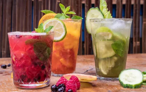 Three fruity mixed drinks are examples of easy mocktail recipes anyone can make