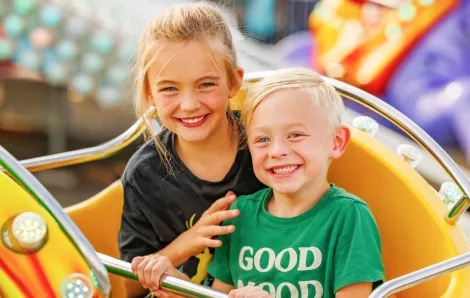 Two kids on a ride at the Washington State Spring Fair