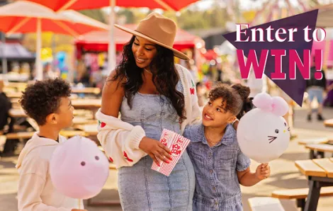 "Enter to Win!" text over family at the fair