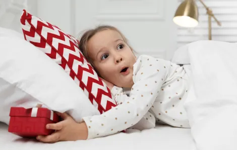 girl finding present under her pillow tooth fairy