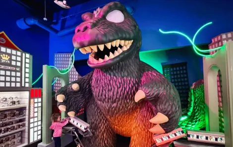 young girl looking at Funko godzilla display on a fun family outing near Seattle