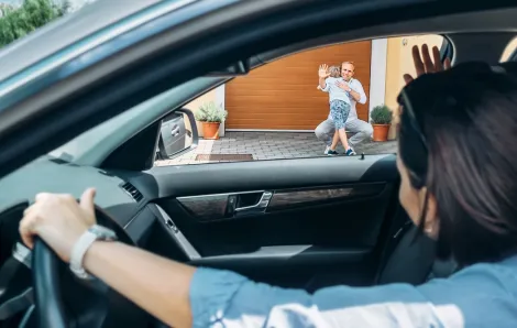 mom dropping off child with dad