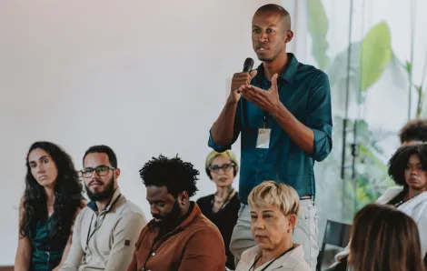 people asking questions and engaging in school board elections