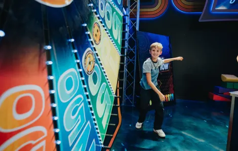 Child with the big spinning wheel at Great Big Game Show