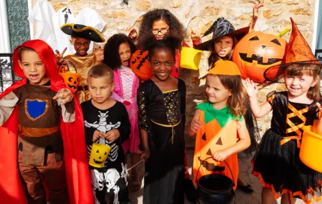 Group of kids in Halloween costumes 