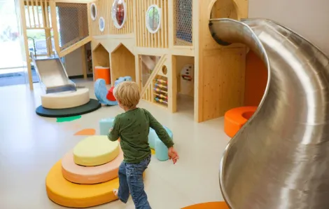 young child playing inside the play area at Nixi City, an  indoor play cafe in Shoreline